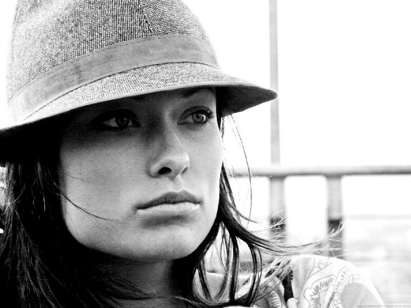 woman in hat looking away