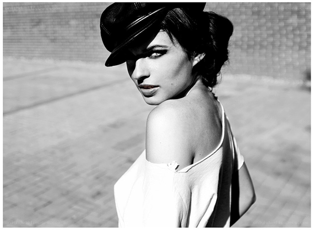 woman in hat looking back