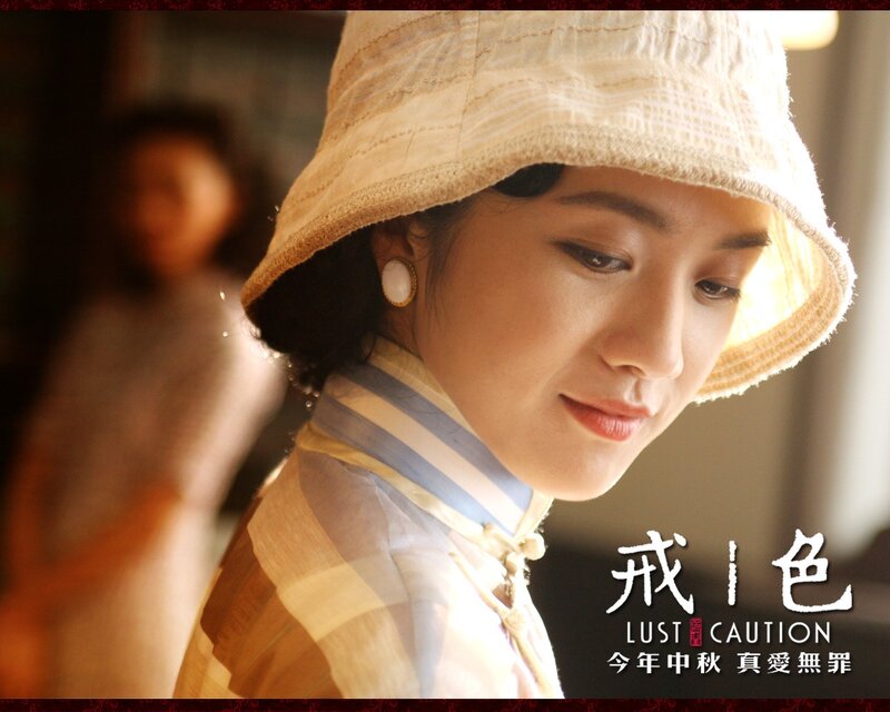 woman in hat looking down