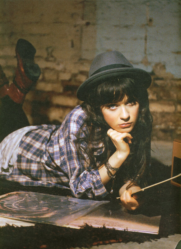 woman in hat lying on floor