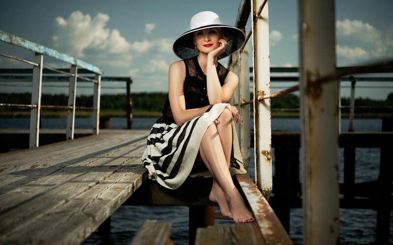 Woman in Hat on Dock