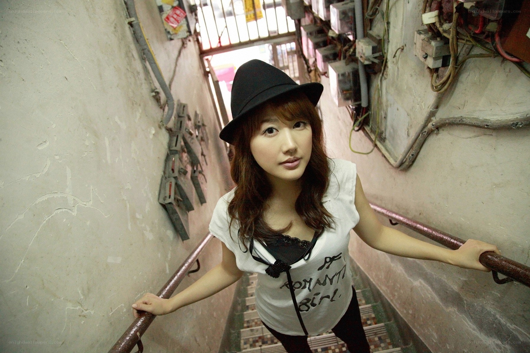 Woman in hat on staircase