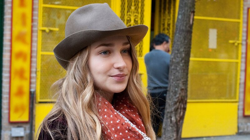 woman in hat on street