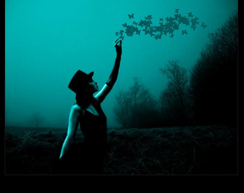 Woman in Hat Releasing Butterflies
