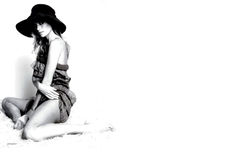 woman in hat sitting on floor