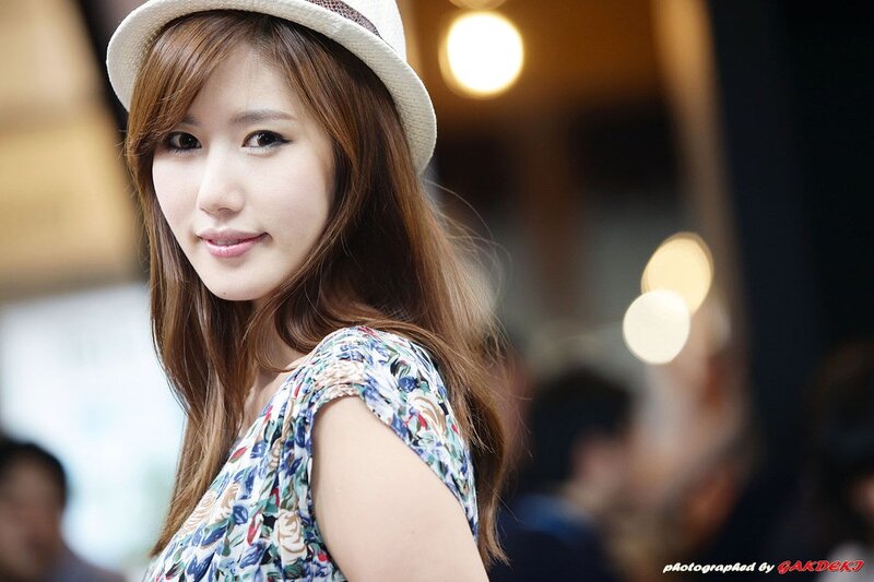 woman in hat smiling