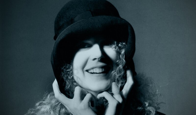 woman in hat smiling