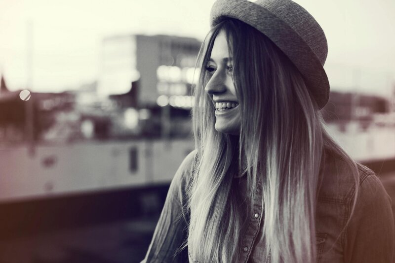 woman in hat smiling