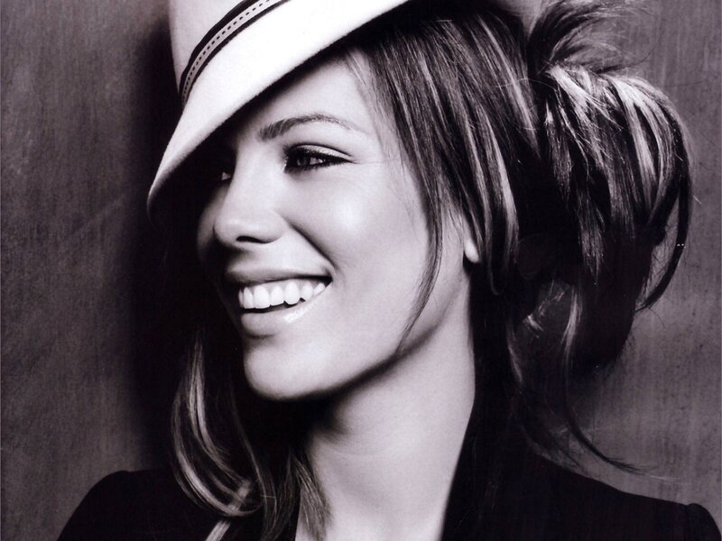 woman in hat smiling