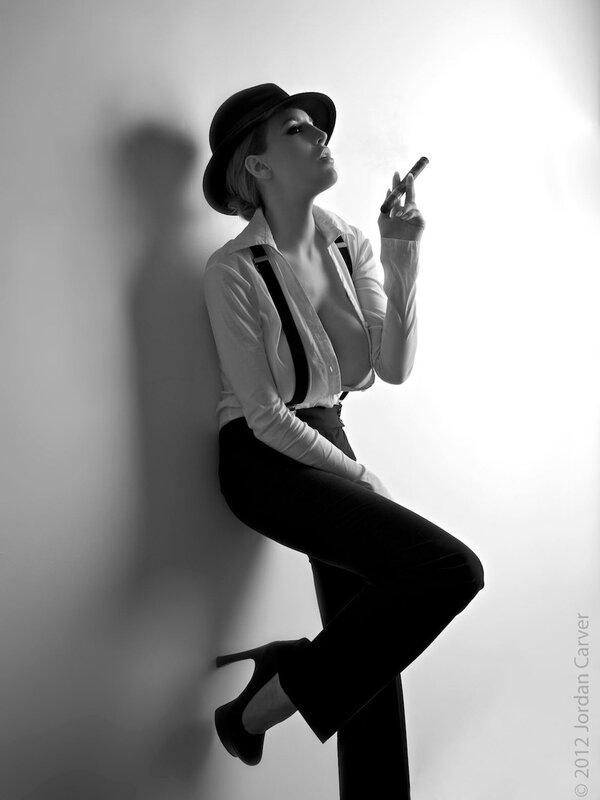 woman in hat smoking cigar
