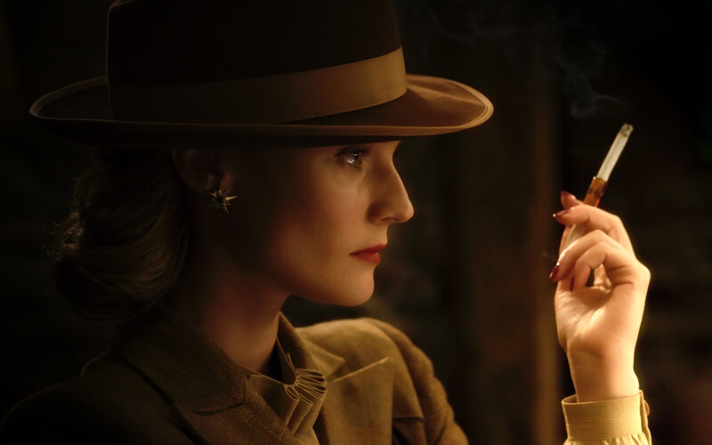 woman in hat smoking cigarette
