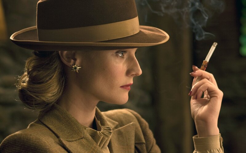 woman in hat smoking cigarette