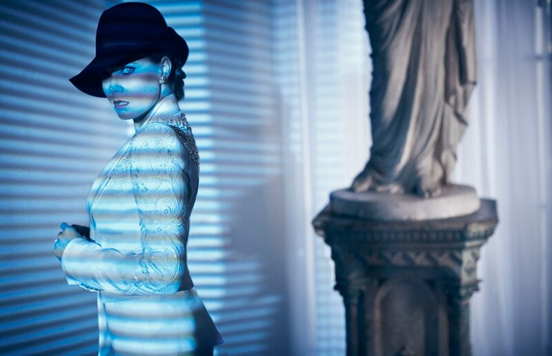 woman in hat with blue light