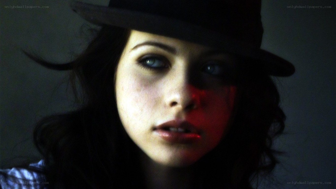 woman in hat with dramatic lighting