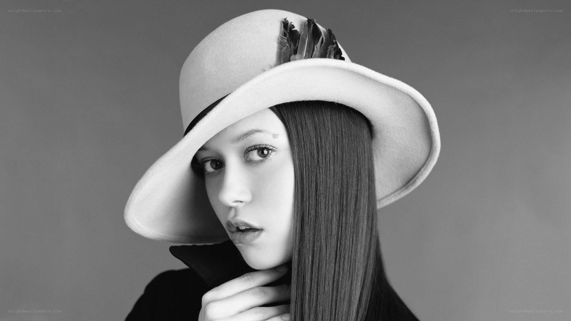 woman in hat with feather