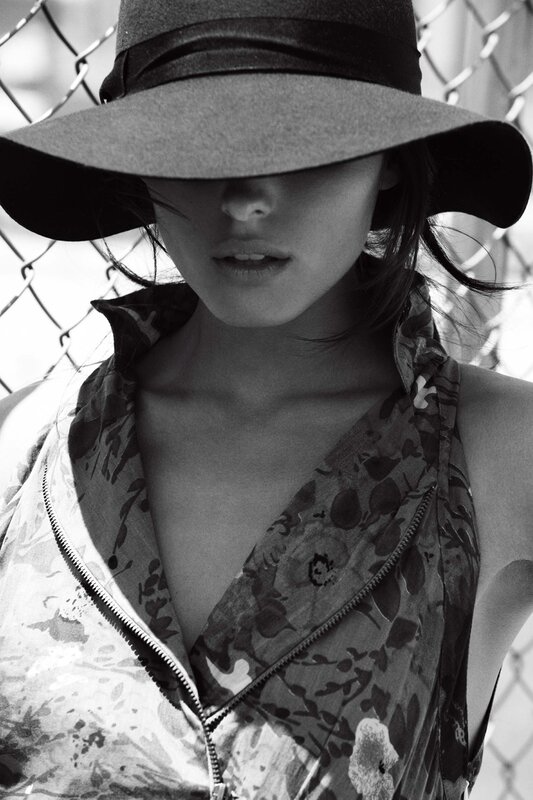 woman in hat with floral top