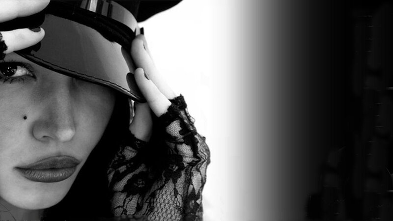 woman in hat with lace gloves