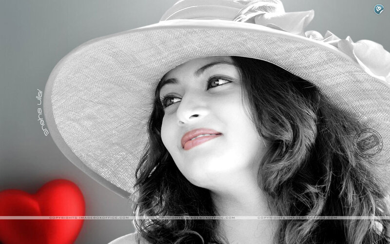 woman in hat with red heart