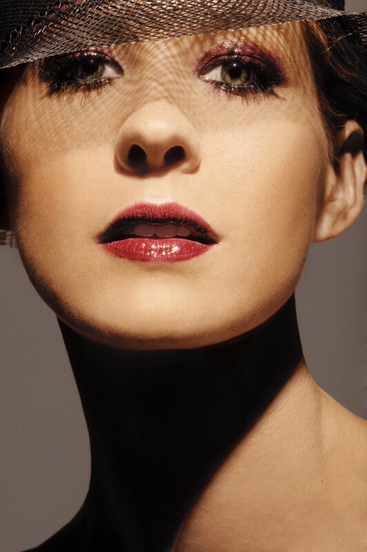 woman in hat with red lipstick