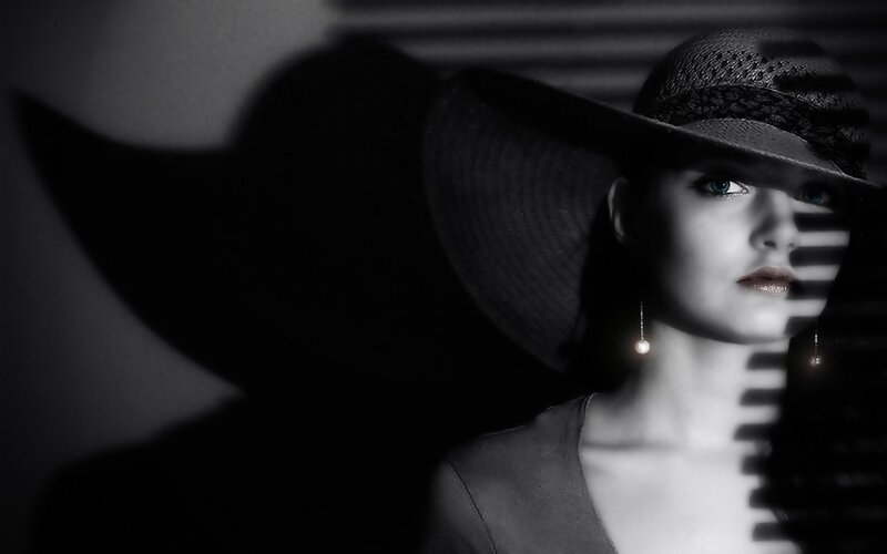 woman in hat with shadow