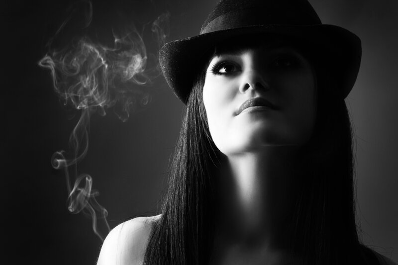 woman in hat with smoke