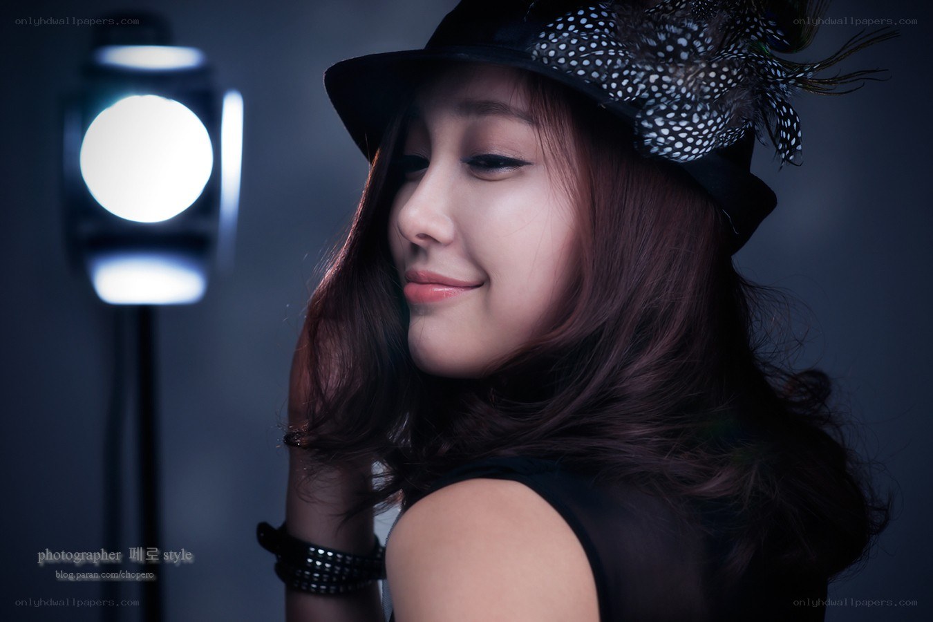 woman in hat with studio light