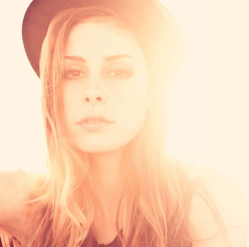 woman in hat with sun glare
