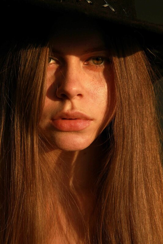 woman in hat with sunlight