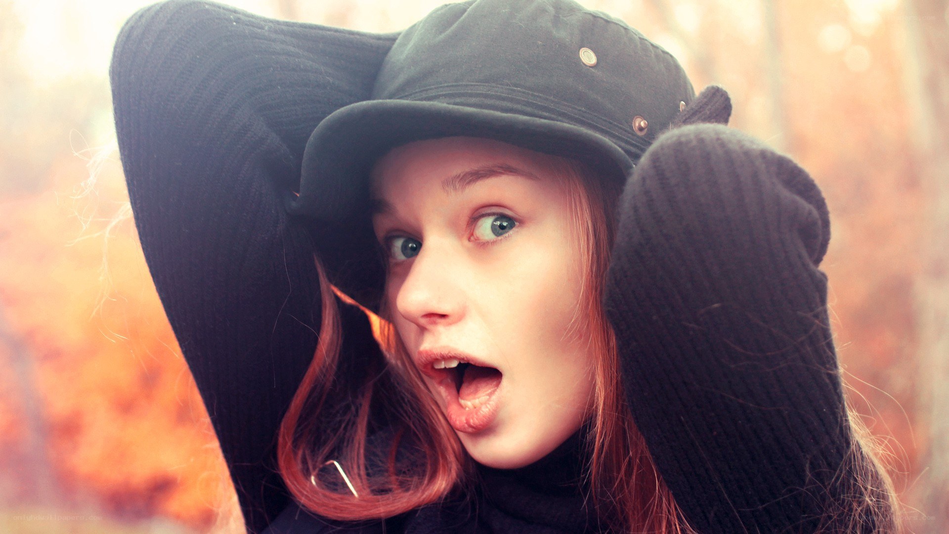 woman in hat with surprised expression