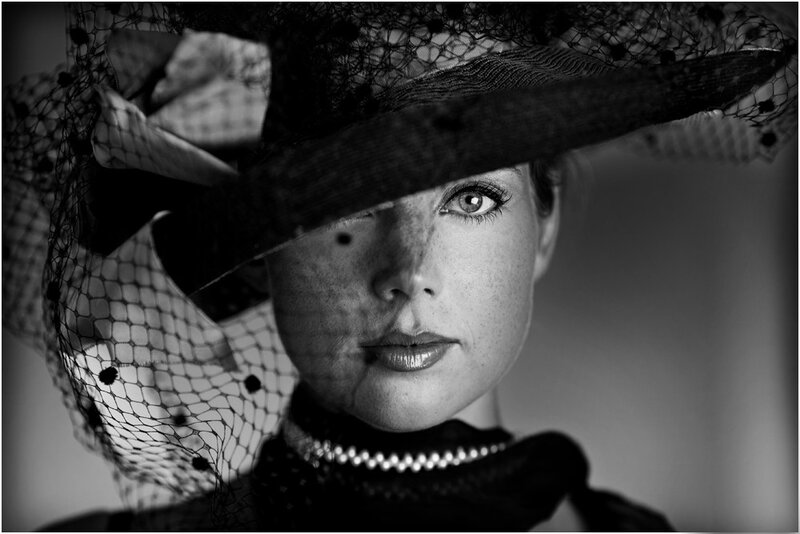 woman in hat with veil