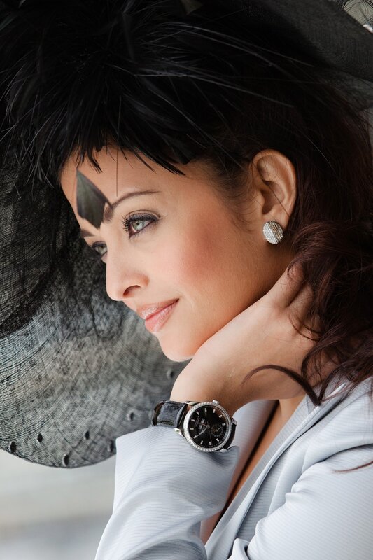 woman in hat with watch