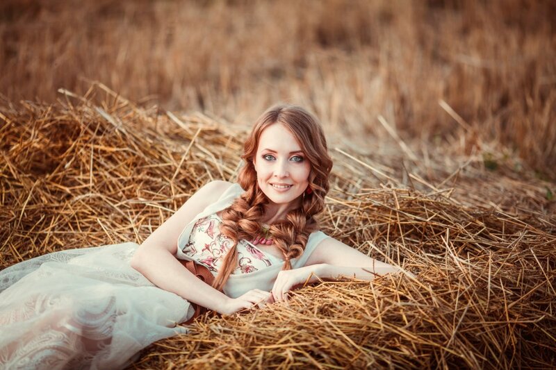 Woman in Hay Bale — Brown, Serene