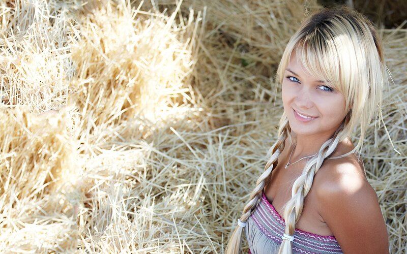 woman in hay bale field