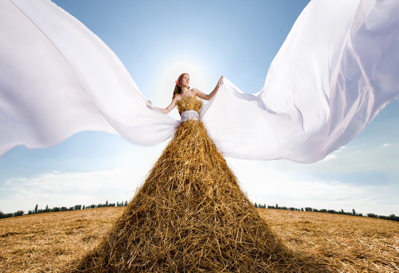 woman in hay dress with flowing fabric