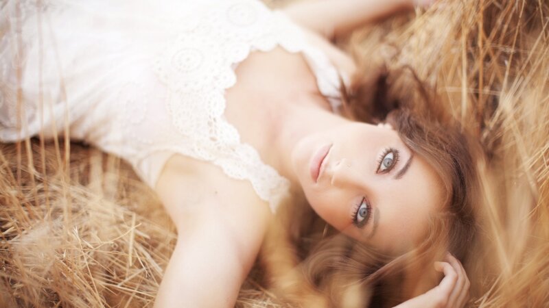 Woman in Hay Field — White, Serene