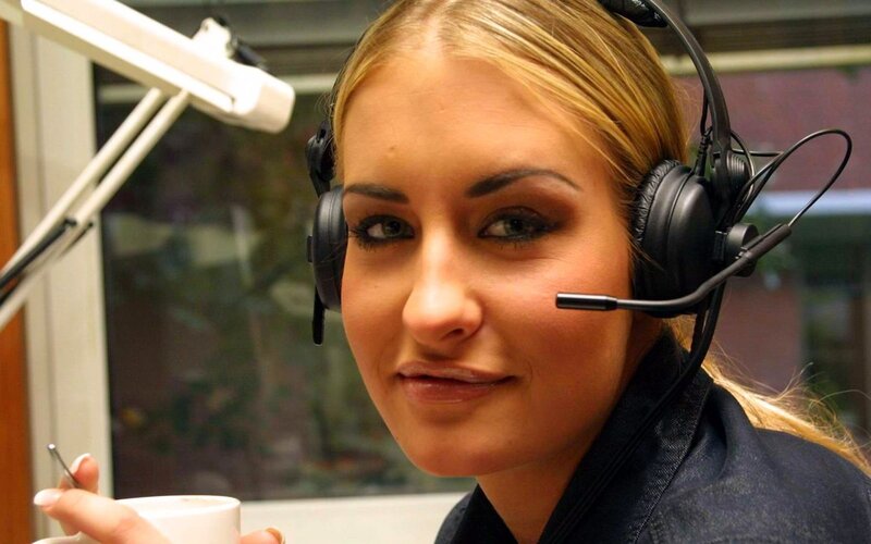 woman in headset at desk