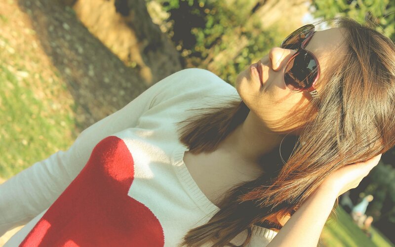 woman in heart sweater