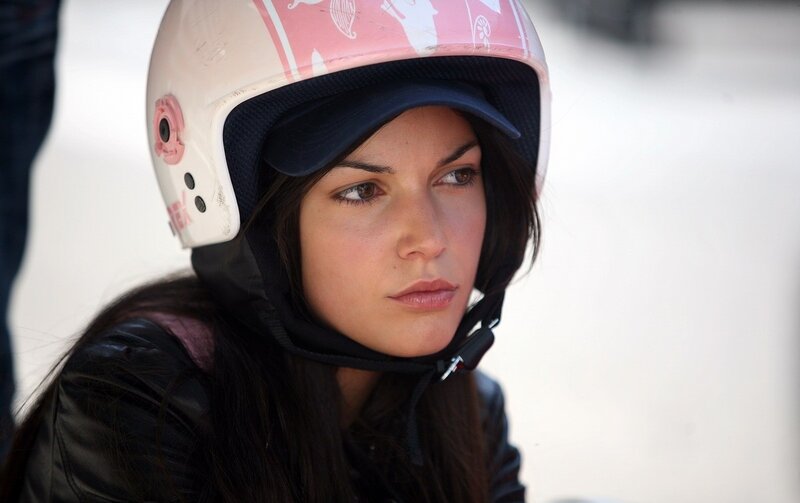 woman in helmet looking away