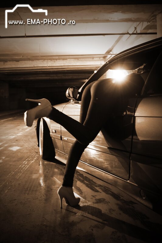 woman in high heels by car