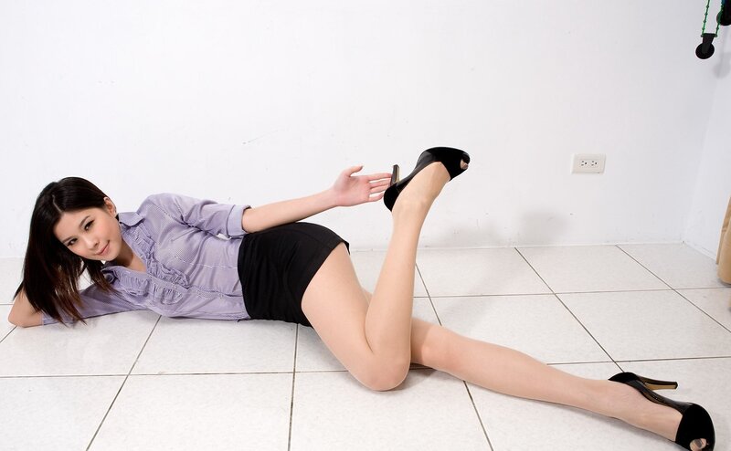 woman in high heels lying on floor