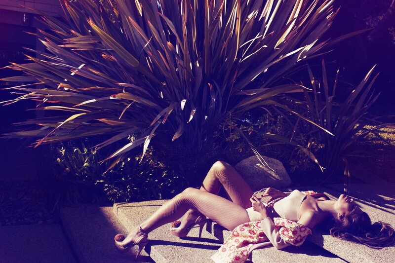 woman in high heels lying on steps