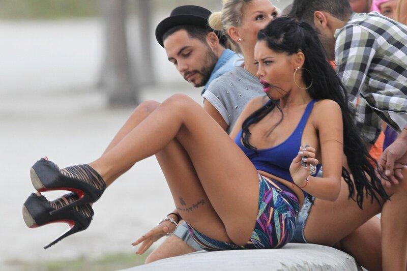 Woman in high heels on beach