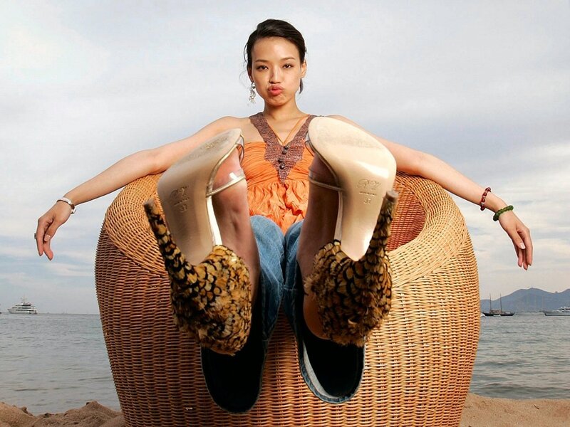 woman in high heels on beach