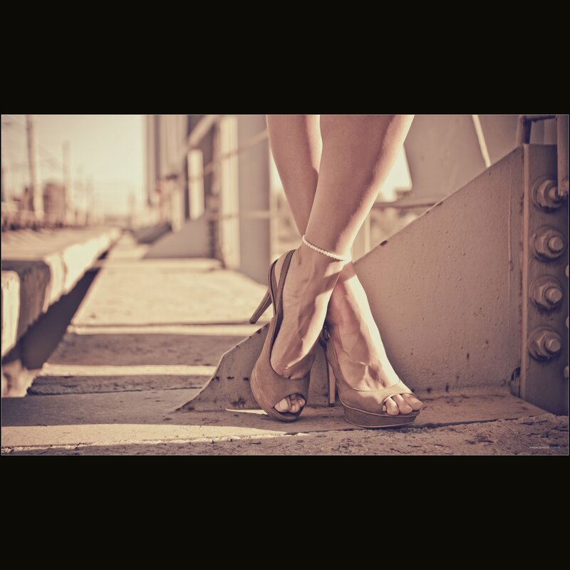 woman in high heels on bridge