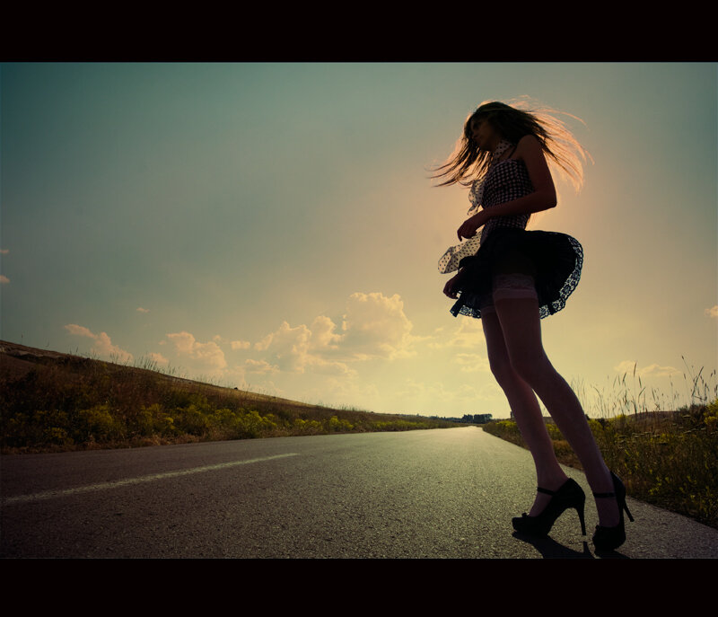 woman in high heels on road