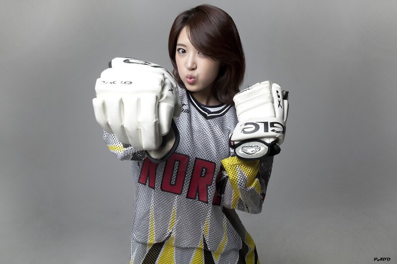 woman in hockey gear posing