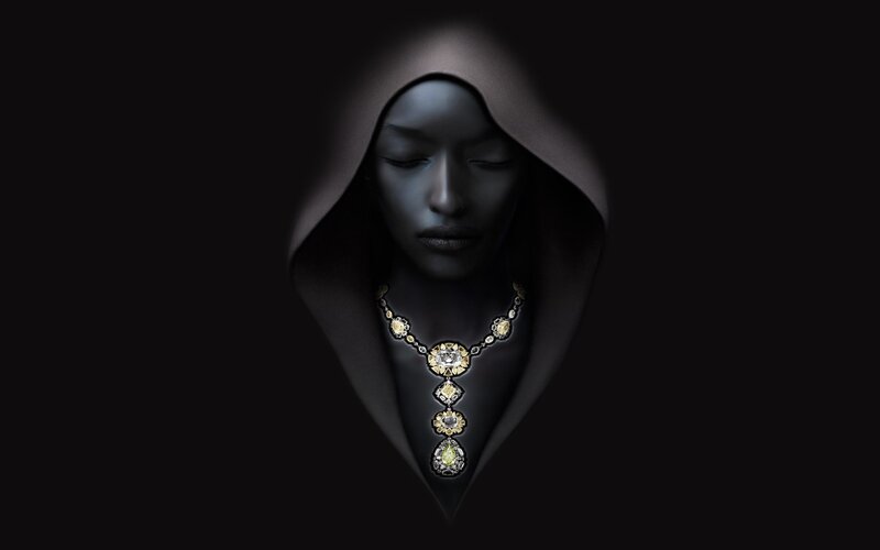 woman in hood with necklace