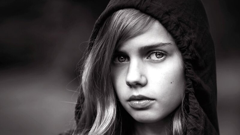 Woman in Hooded Jacket — Black, Serious