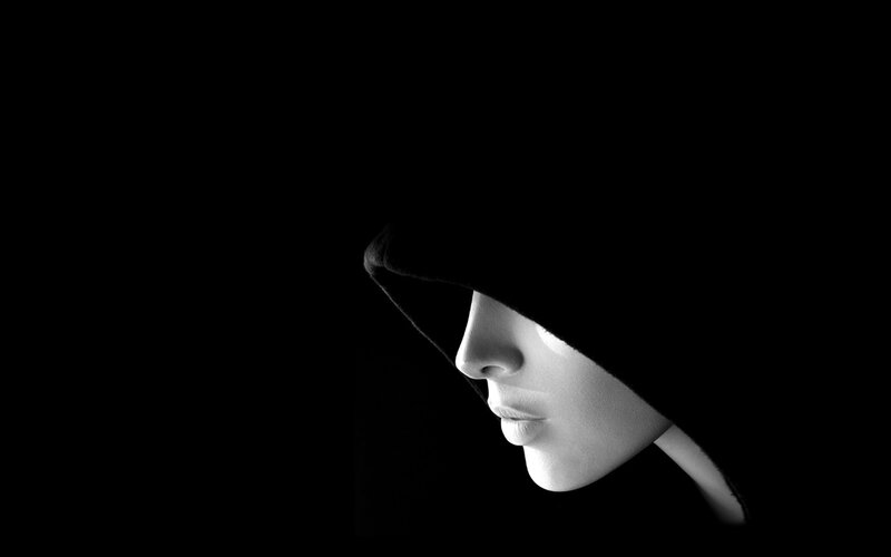 woman in hooded silhouette