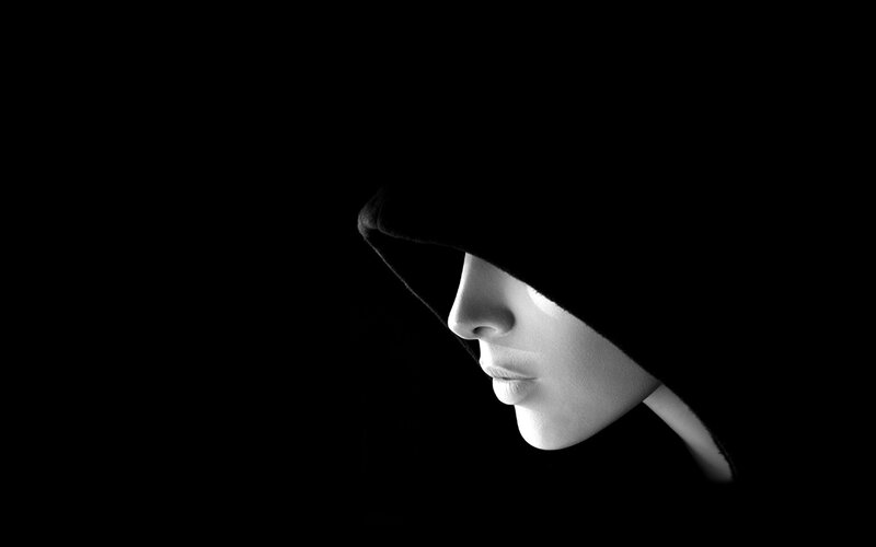 woman in hooded silhouette